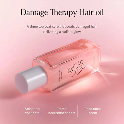 Hair oil bottle with white cap removed, showing pink-tinted liquid