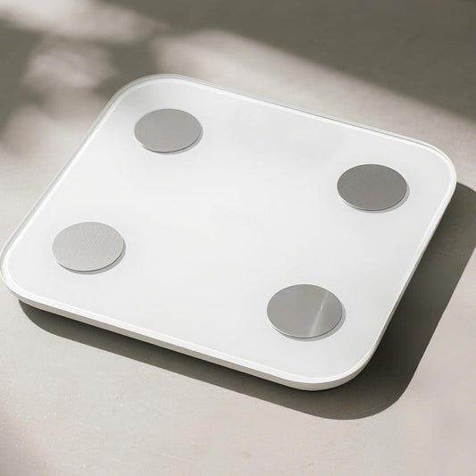 HALO Bluetooth smart body scale, white top with four round metal sensor pads
