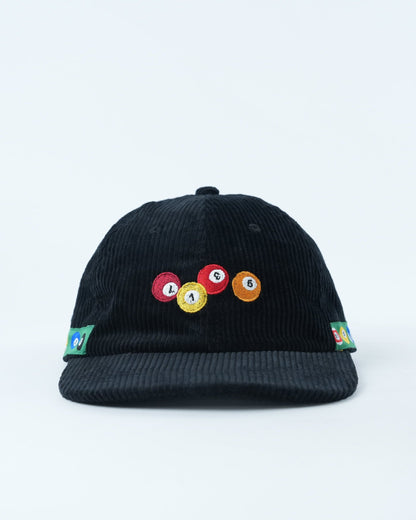 Black corduroy baseball cap with multicolor pool-ball patch on front