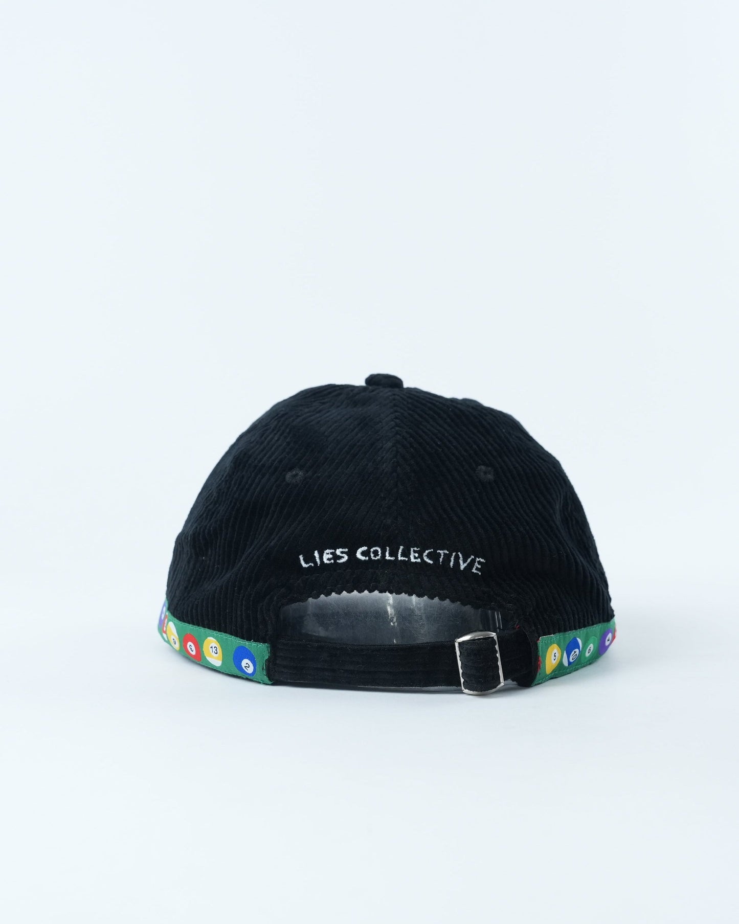 Black corduroy baseball cap with "LIES COLLECTIVE" label and multicolor trim