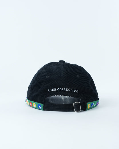 Black corduroy baseball cap with "LIES COLLECTIVE" label and multicolor trim