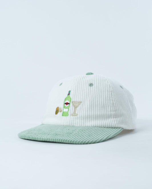 White ribbed beanie with green brim and embroidered cocktail martini graphic, side view
