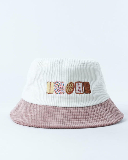 Bucket hat with white knit crown, mauve brim, and biscuit graphic front patch