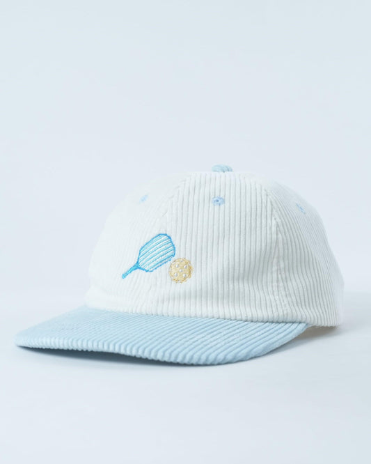 White ribbed knit baseball cap with blue paddle, yellow ball, and small blue dots