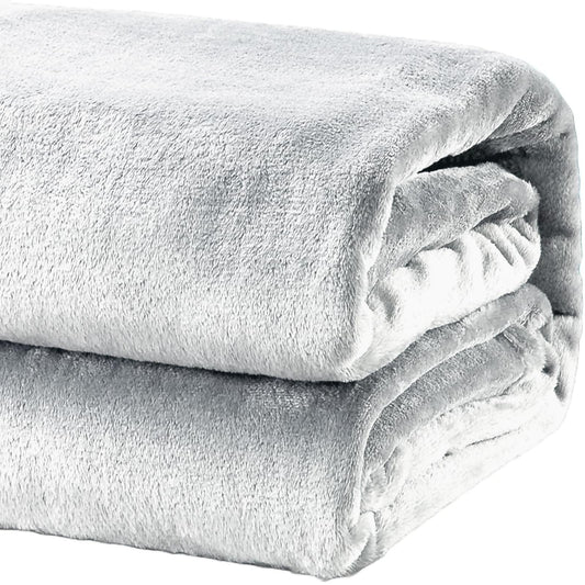 Heavyweight acrylic mink throw blanket, light gray, folded with plush fuzzy texture
