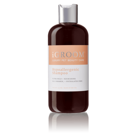 iGROOM hypoallergenic pet shampoo bottle, dark amber glass with silver cap
