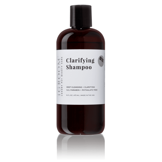 iGroom clarifying shampoo bottle, dark amber with black cap