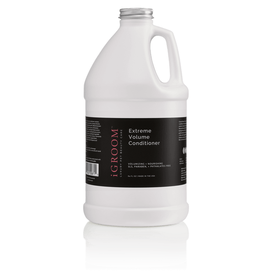 White conditioner bottle with handle, label reading Extreme Volume Conditioner