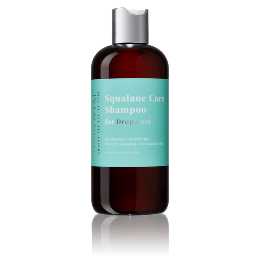 iGroom Squalane Care Shampoo bottle, dark amber with teal label and silver cap