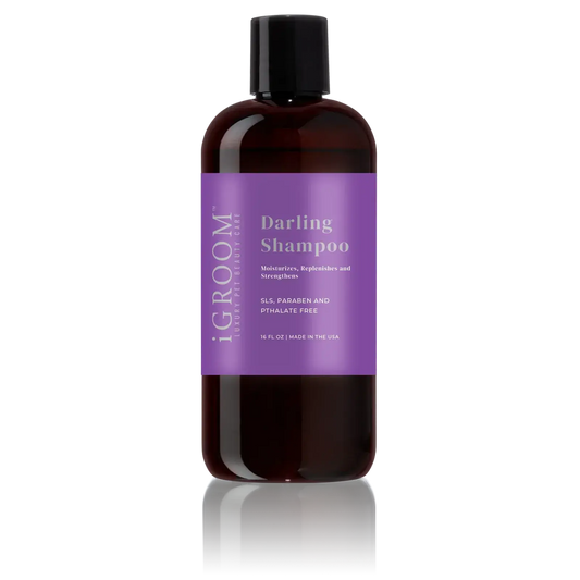 iGroom Darling shampoo bottle, dark amber with black cap and purple label
