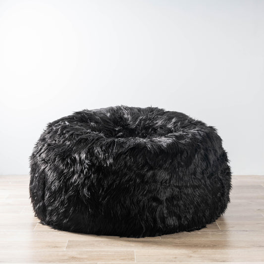 Black faux-fur bean bag with rounded, plush seat