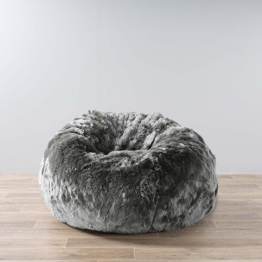 Charcoal plush fur bean bag with round, cushioned shape
