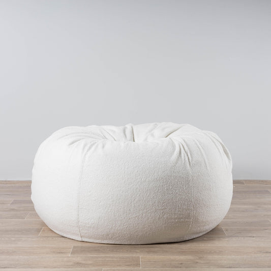 White boucle bean bag chair with gathered top and round, low profile.