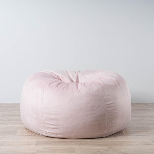 Blush pink faux fur bean bag with rounded, cushioned shape