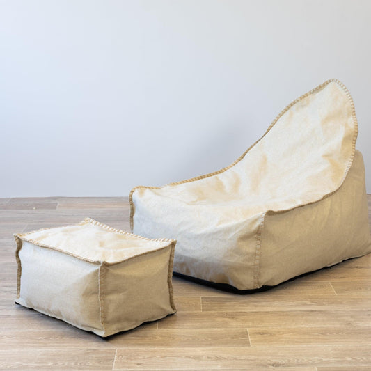 Natural bean bag and ottoman set, beige fabric with stitched seams and rounded shape