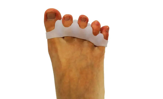 Wide toe separator strap on foot, separating toes for alignment support