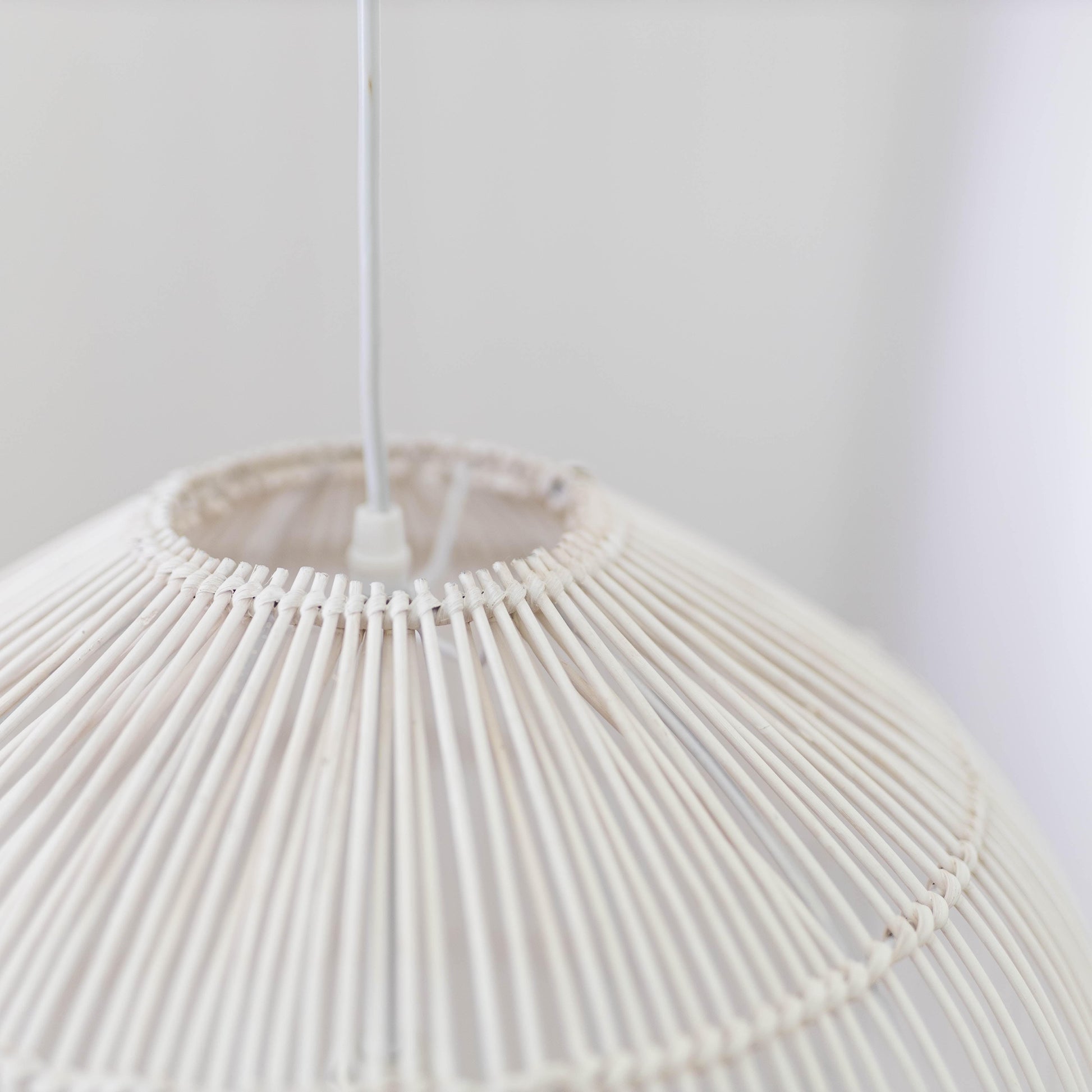 Whitewash rattan cane pendant light top with central socket and radiating cane ribs