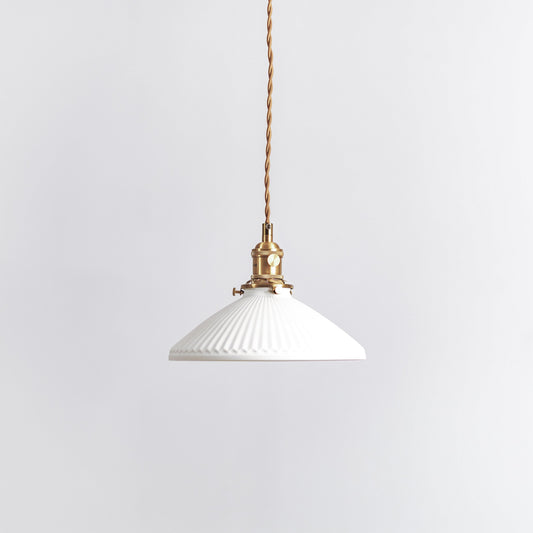 Ceramic pleated pendant light with white shade and brushed brass socket on braided cord