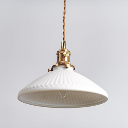Ceramic pleated pendant light with wide white ribbed shade and brass top mount