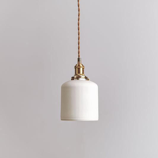 White ceramic ribbed pendant light with pleated drum shade and brass cord