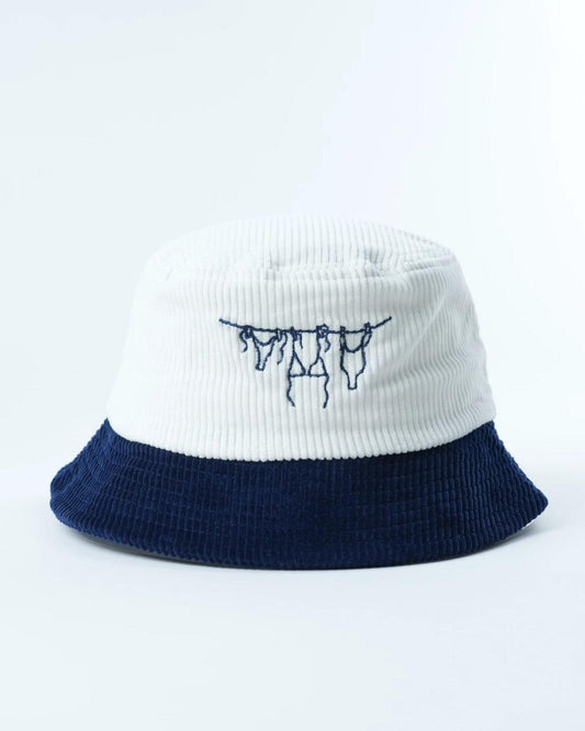 Two-tone bucket hat with navy brim and white crown, embroidered navy hanging letters