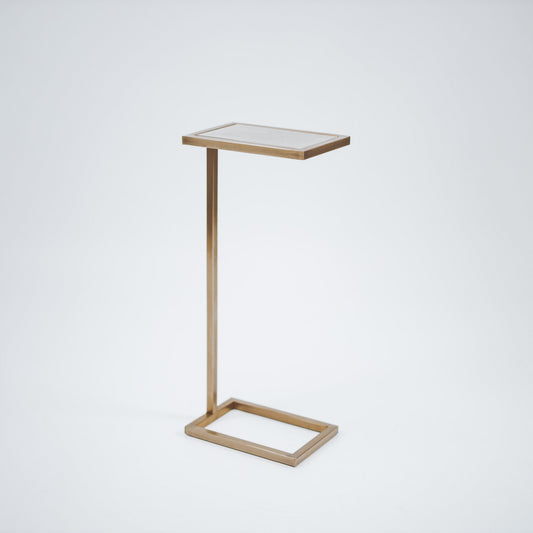 Gold-toned metal side table with glass top and square open frame