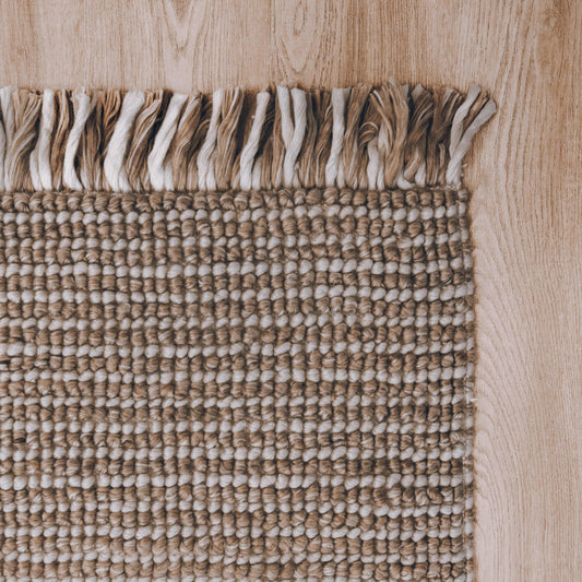 Amora handwoven floor rug, striped terracotta & natural weave, fringed edge.