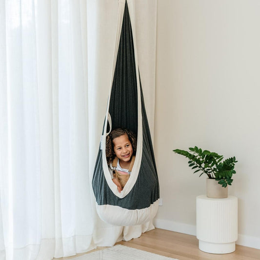 Charcoal swing pod cocoon with white trim, hanging hammock-style cover