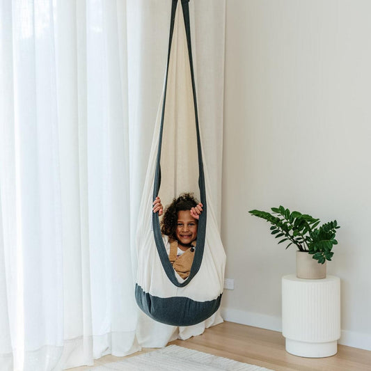 White swing pod hammock with charcoal trim, hanging cocoon