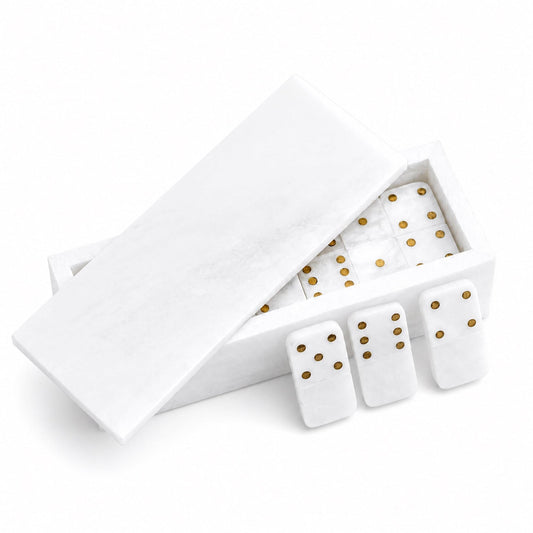 White hinged domino box with gold-dot tiles and loose dominoes inside