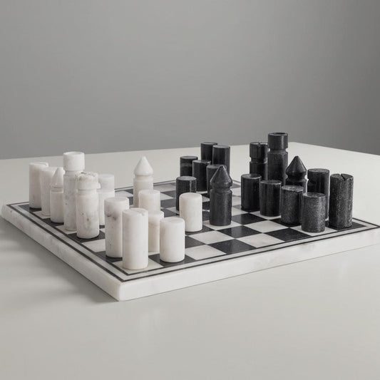 Marble chess set with white and dark pieces on a black-and-white checkerboard.
