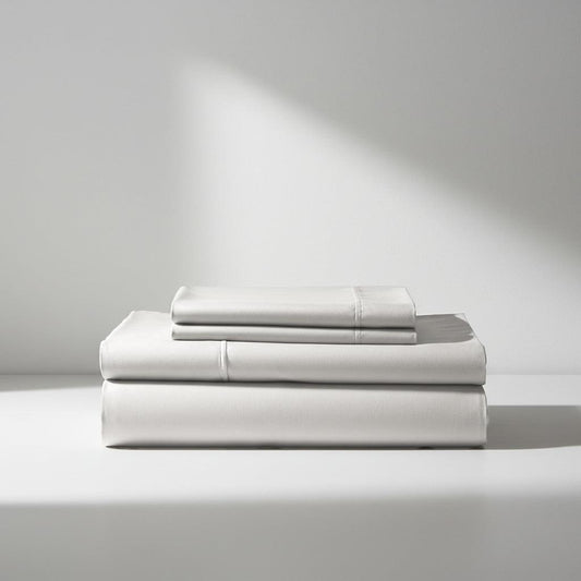 White bamboo sheet set with neatly folded fitted and flat sheets
