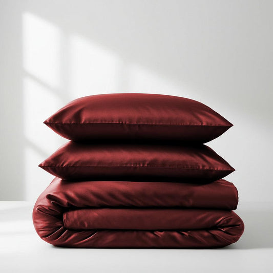 Wine red satin quilt cover set, folded with matching pillowcases
