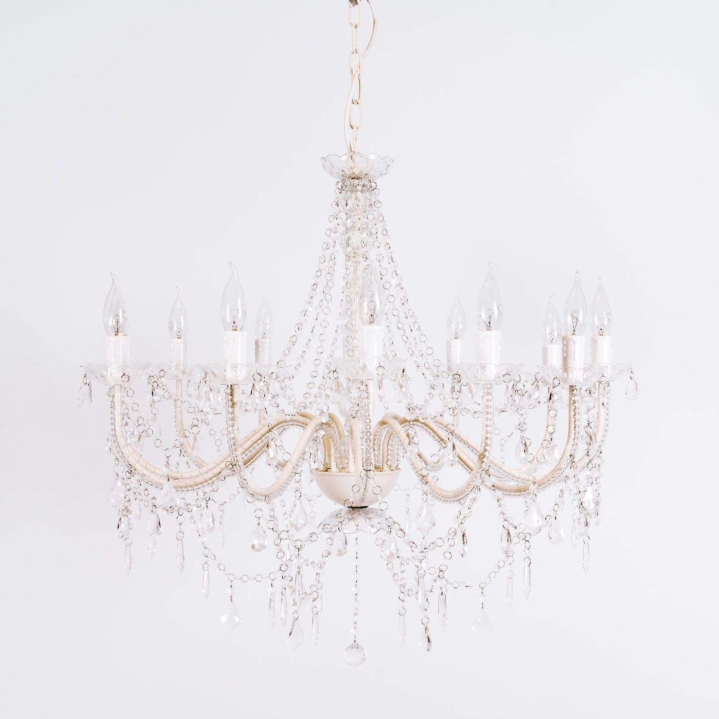 Cassie 12-light chandelier close-up with clear glass crystals and gold-toned arms