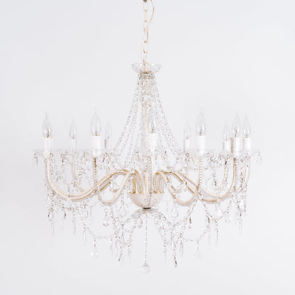 Cassie 12-light chandelier close-up with clear glass crystals and gold-toned arms