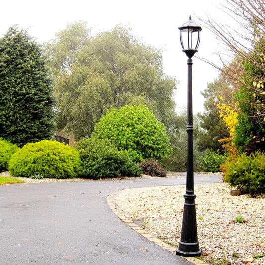 Black solar garden post light with clear lantern glass and curved base