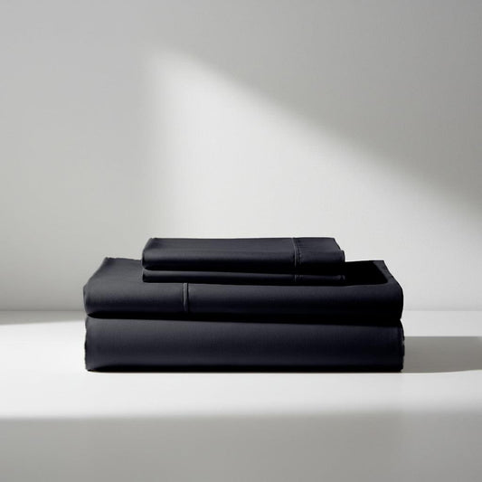Black silky bamboo sheet set, folded flat stack with smooth top fold