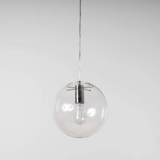Clear glass globe pendant light with chrome socket and stem, hanging from a cord