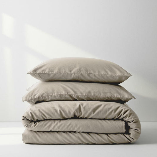 Champagne latte quilt cover set in light beige, folded with pillowcases stacked