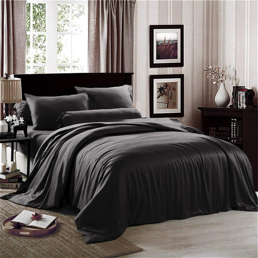 Black king sheet set on a made bed with matching pillowcases
