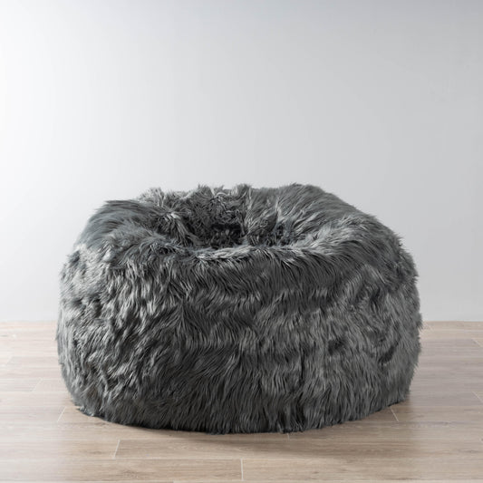 Charcoal faux-fur bean bag with rounded oval shape