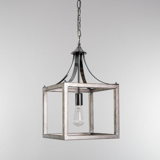 Chrome lantern pendant light with clear glass bulb inside open metal frame