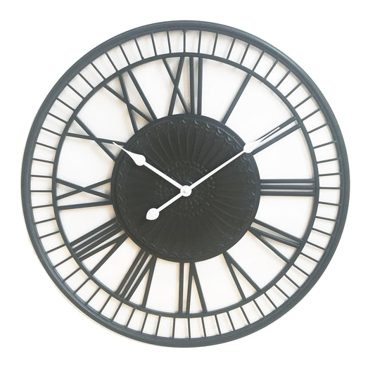 Large charcoal wall clock face with metal grid rim and white hour/minute hands
