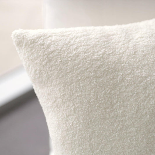 Boucle teddy cushion, French white textured fabric close-up