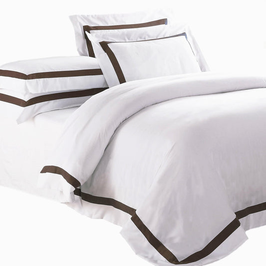 White quilt cover set with brown-trimmed edges and matching pillow covers