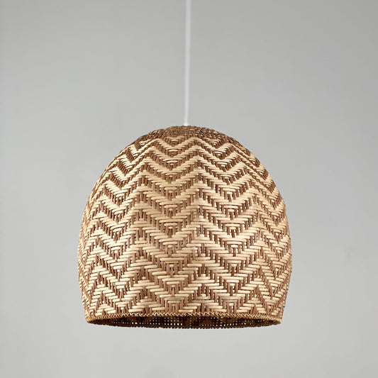 Natural rattan cane dome pendant light shade, close-up woven zigzag pattern
