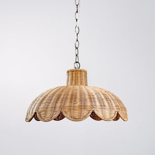 Natural rattan scallop pendant light with woven dome shade and hanging chain.