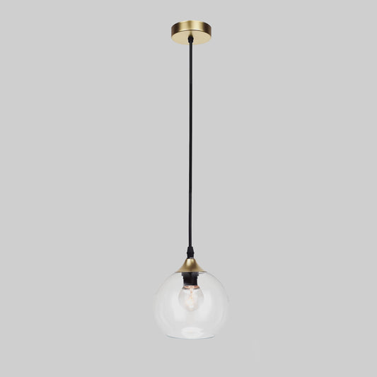 Gold pendant light with clear glass globe and black cord