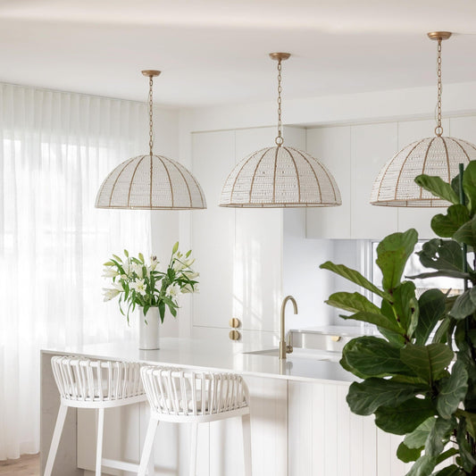 Three gold chain dome pendant lights with white beaded mesh shades