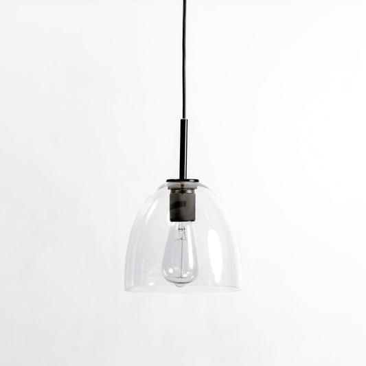 Black pendant light with clear glass shade and black canopy on a cord.